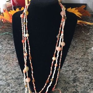 Gorgeous coral beaded trio of necklaces.